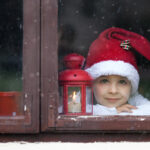 Adorable,Boy,,Looking,Through,Window,,Waiting,For,Santa