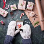 woman-in-mittens-packing-christmas-gift-boxes.jpg